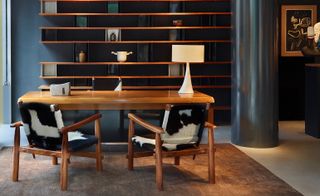 armchair with black and white cushions in work area