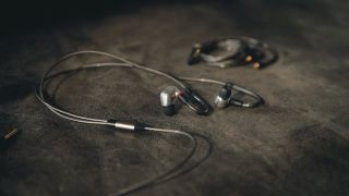 Sennheiser IE 900 lifestyle image on on a dark background