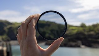 The Kenko Pro1D+ circular polarizing filter held up to the sun