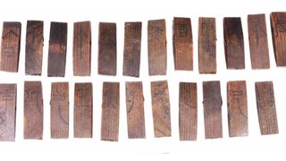 Wooden slips marked with Chinese characters that relate to the traditional Tiangan Dizhi astronomical calendar.