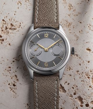 grey watch on stone background