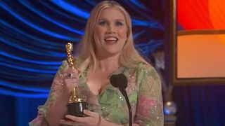 Emerald Fennell holding her Oscar 