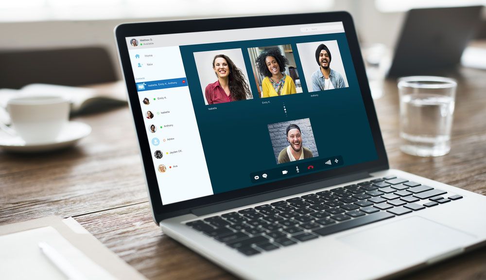 A video conference on a laptop screen.