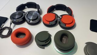 Dyson OnTrac headphones with red and green colour options