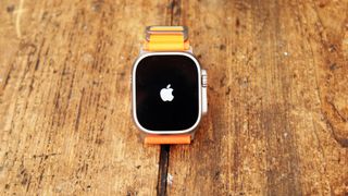 Apple Watch Ultra in use on wrist and on table