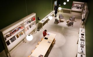 Photobooks are housed in vitrines and displayed on shelves