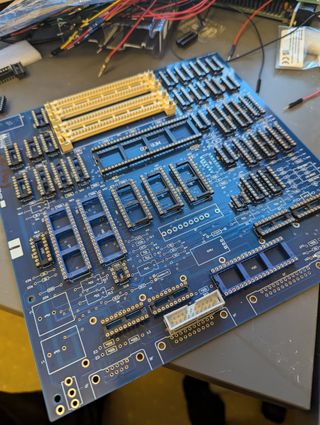 The Macintosh Plus logic board without ICs or other components installed