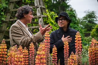 Dr Bill Lumsden x Azuma Makoto amid flowers