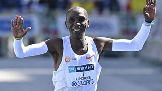 Eliud Kipchoge celebrates as he crosses the line at the Tokyo Marathon