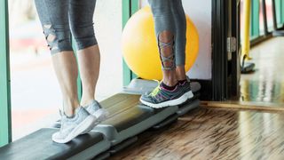 a photo of two women doing calf raises 