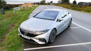 Mercedes Benz EQS Sedan parked outside by lake