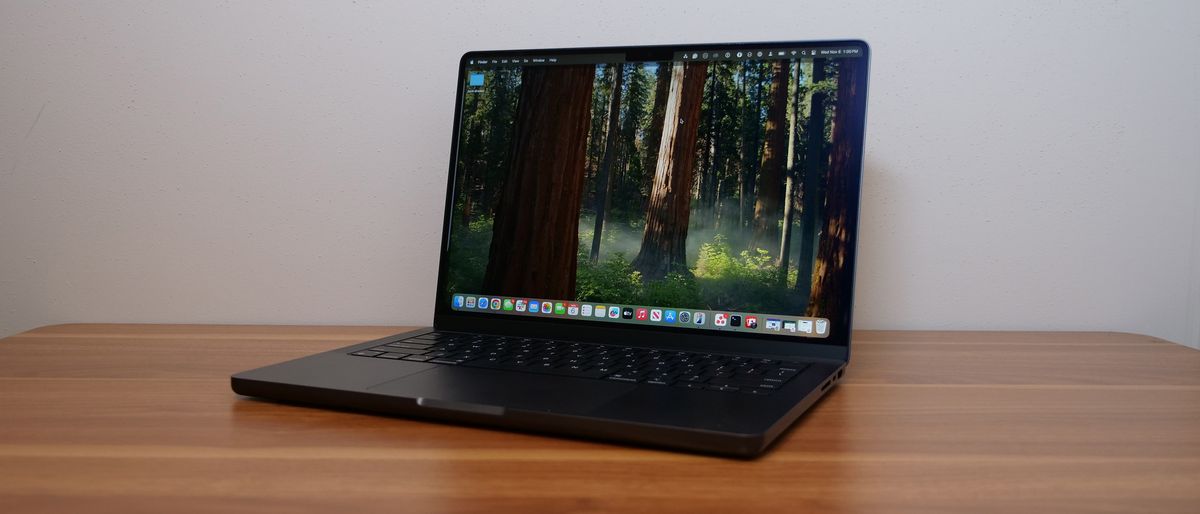 Apple MacBook Pro 14-inch M4 2024 on a wooden desk