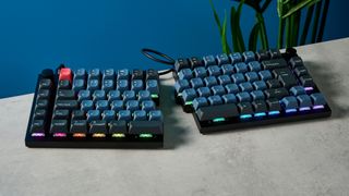 A carbon black Keychron Q11 split ergonomic keyboard