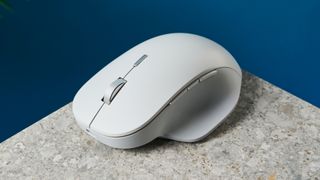 A white wireless Microsoft Surface Precision mouse