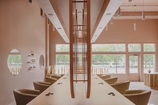 Side view of mirrors, counter and chairs at the Pressed Roots hair salon