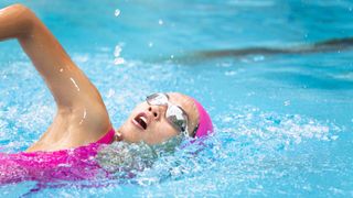 A woman swimming in a pool 