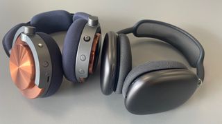 Dyson OnTrac and Apple AirPods Max headphones lying side by side.