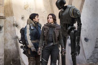 Rogue One: A Star Wars Story. L to R: Cassian Andor (Diego Luna), Jyn Erso (Felicity Jones) and K-2SO (Alan Tudyk)..