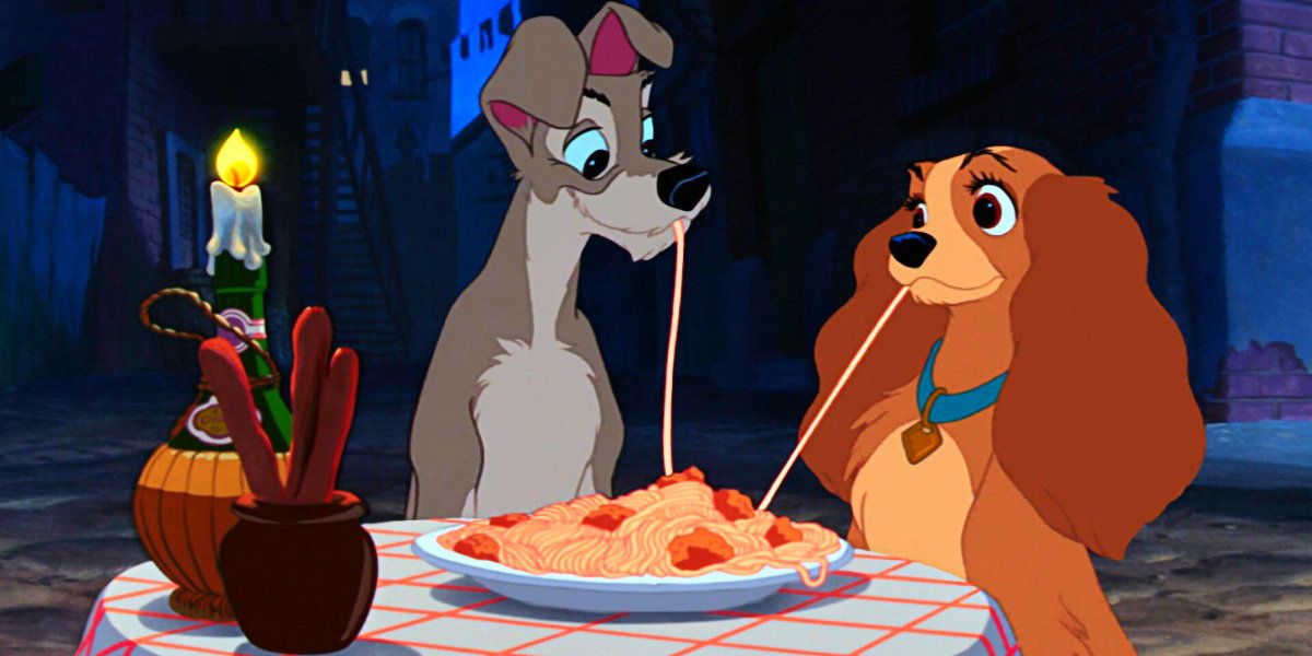 Lady and The Tramp eating spaghetti together at Tony&#039;s.