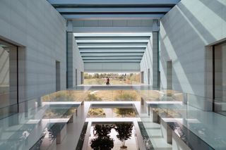 Inside a multi level building with balconies overlooking lower floors