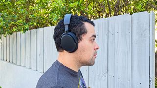 Sennheiser Accentum worn by reviewer testing ANC