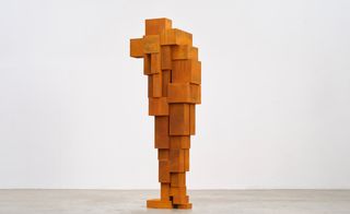 orange figure like structure made of bricks