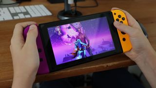 A child plays Fortnite on a Nintendo Switch.