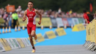 Alex Yee of Team England runs to the finish line during the Men's Individual Sprint Distance Triathlon Final during the Birmingham 2022 Commonwealth Games ahead of the Paris Olympics 2024