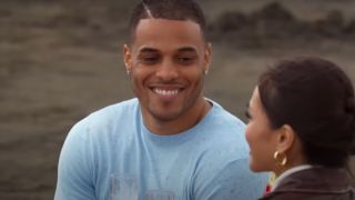 Grant Ellis smiles at Jenn Tran during their one-on-one date on a beach on The Bachelorette Season 21.