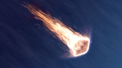 a space capsule falls through the atmosphere engulfed in a fireball.