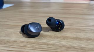 Sennheiser Momentum True Wireless 4 earbuds on a desk