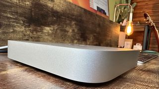 M2 Mac mini on a wooden desk