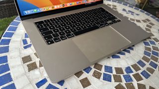 At home with 15-inch MacBook Air, on a mosaic balcony table and on a wooden floor.