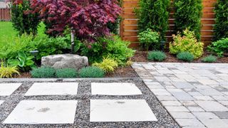 Tidy patio and paving in backyard