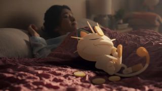 A still from the Pokémon Sleep trailer showing a Pokémon sleeping on someone's bed