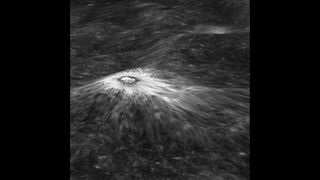 A view across the rim and into Chaplygin crater displays a fresh young, perfectly preserved crater and ejecta blanket. This lunar crater is 200 m larger than Meteor crater (1200 m diameter) in Arizona.