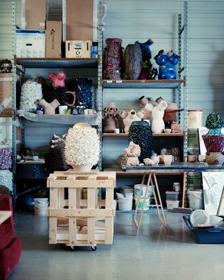 Houndekpinkou’s Parisian studio, with, sitting atop an empty wooden crate