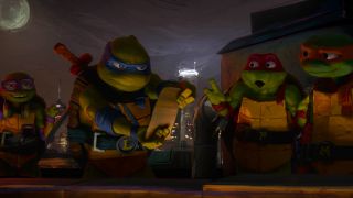 The Ninja Turtles hanging out on a rooftop, while looking over their grocery list, in Teenage Mutant Ninja Turtles: Mutant Mayhem.