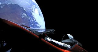 A Tesla Roadster, carrying a dummy passenger named "Starman," orbits the Earth after launching into space on the Falcon Heavy on Feb. 6, 2018.
