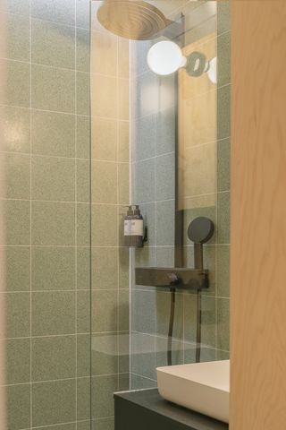 A green tiled shower