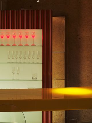 Shiro Kuramata’s wine glass-shaped ‘Samba-M’ lamps line the top shelves of the bar, which serves a selection of cocktails, including the Melon Ball, made from Midori, vodka and fresh orange juice