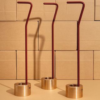 Three red metal door stoppers