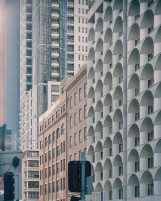 view from the street of sydney architecture, concrete building with arched windows