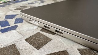 At home with 15-inch MacBook Air, on a mosaic balcony table and on a wooden floor.