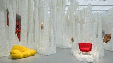 Estúdio Campana exhibition designed like a white cave with colourful furniture 