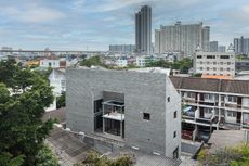 Back of the House from the air showing the house with the city backdrop