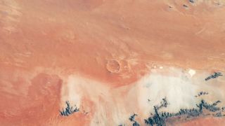 Roter Kamm impact crater in Namibia looks like a scene that would be found on Mars.