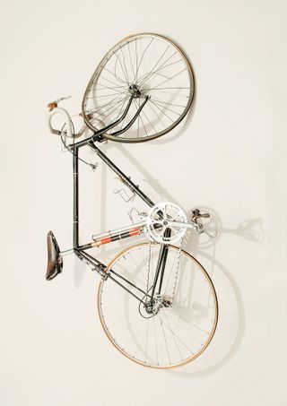 Paul Smith's crashed bicycle on white background