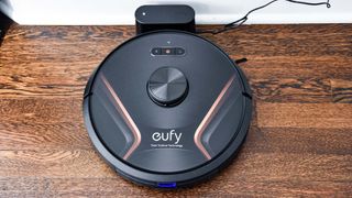 Eufy RoboVac X8 Hybrid docked on charger