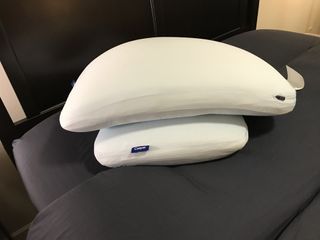 Two Casper Hybrid Snow Pillows, one stacked perpendicular on top of the other